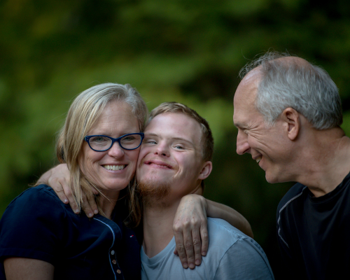 A photo of three people happy together