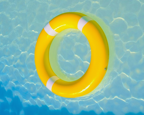 A yellow life saver in blue water