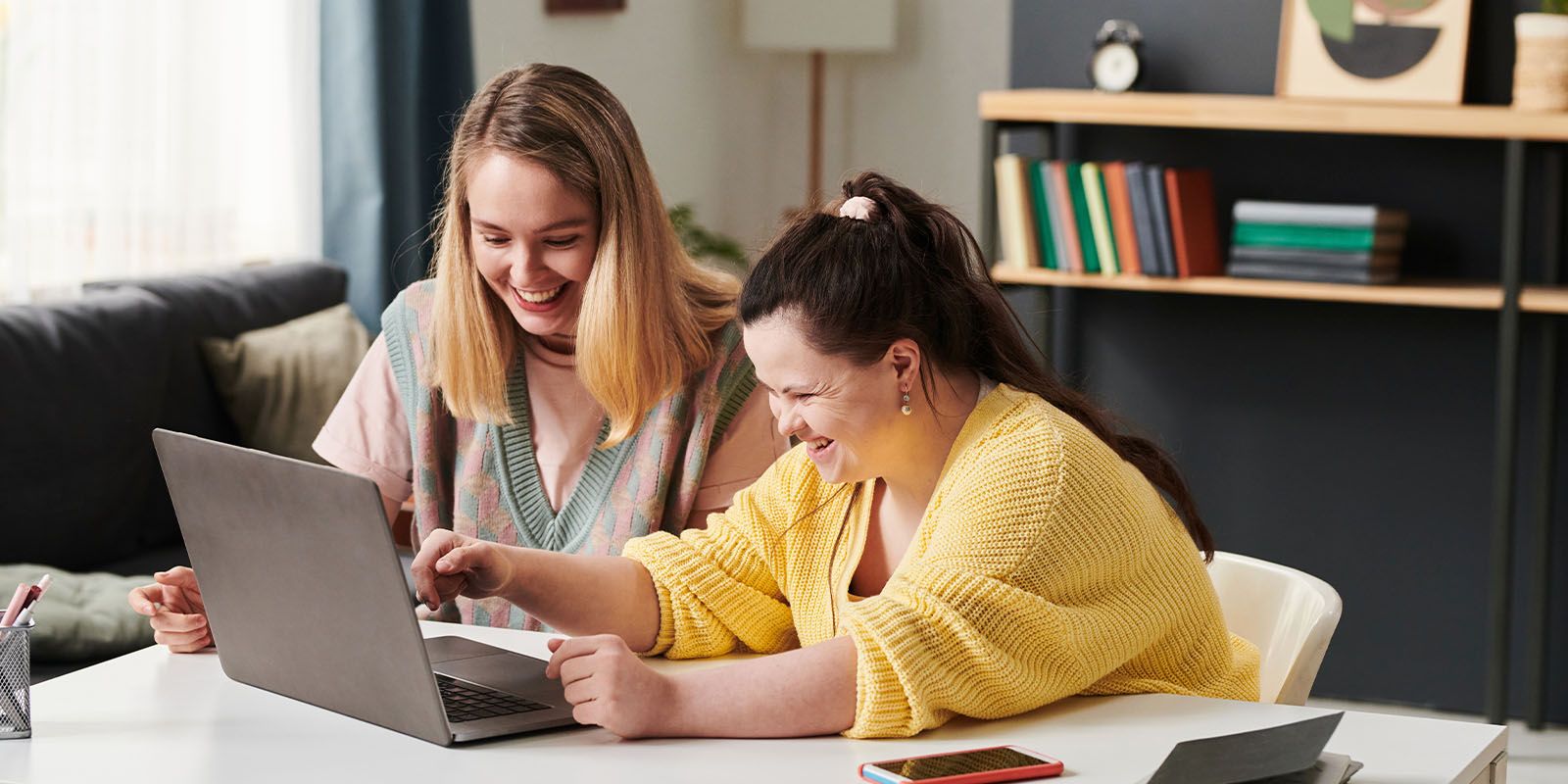 Young students with teacher looking at a iPad