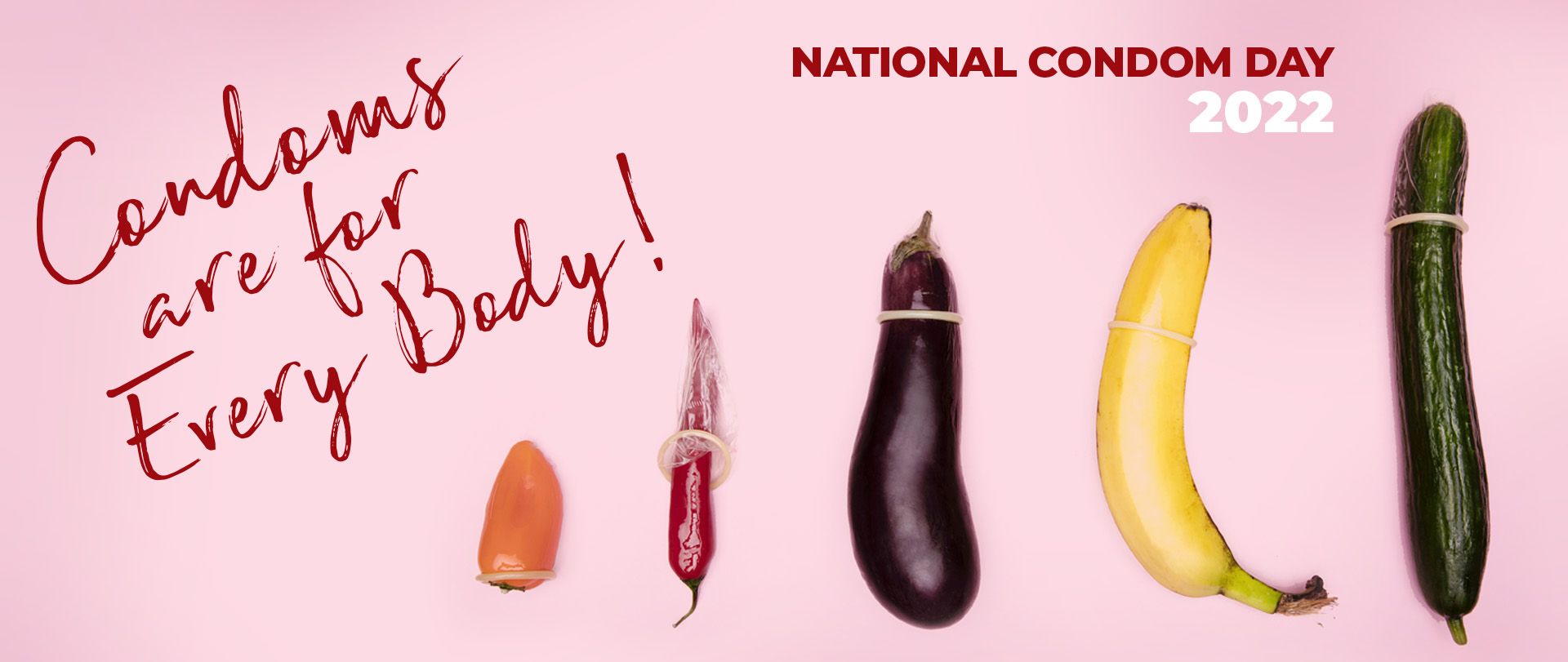 Various sized fruit and vegetables with Condoms against a pink background and the words 'Condoms are for Every Body".