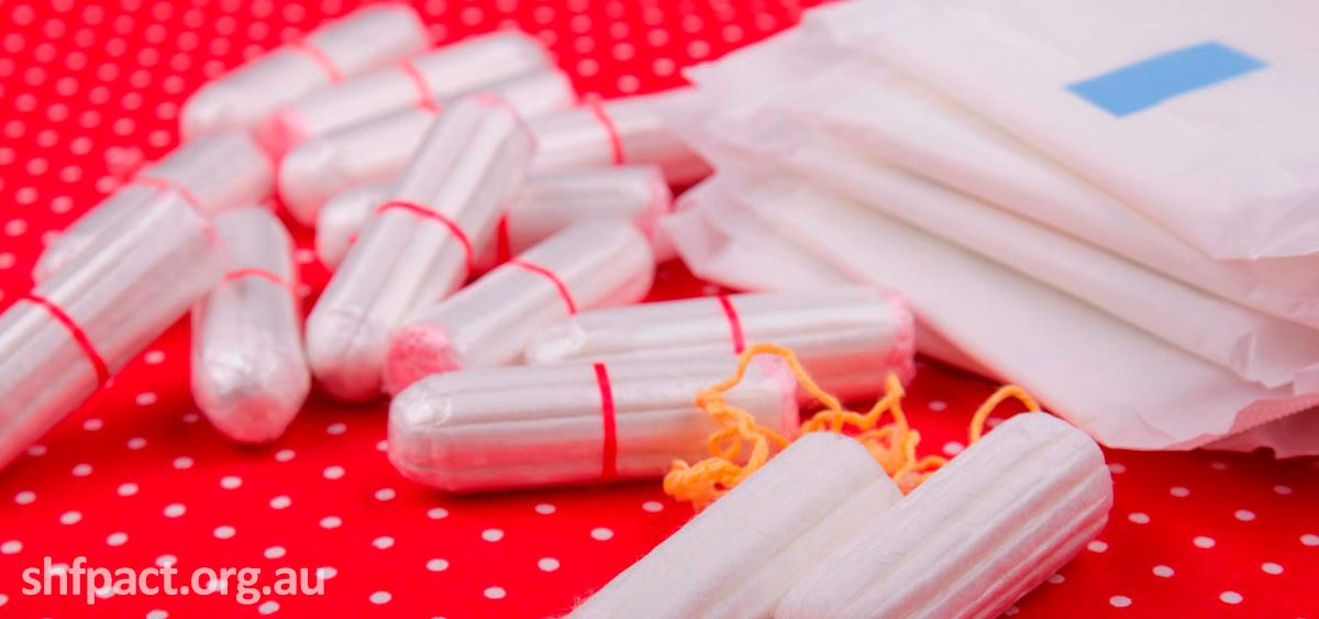 A photo of tampons on a red table